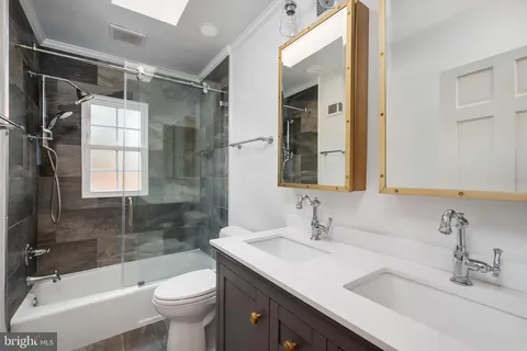 a bathroom with a shower and toilet
