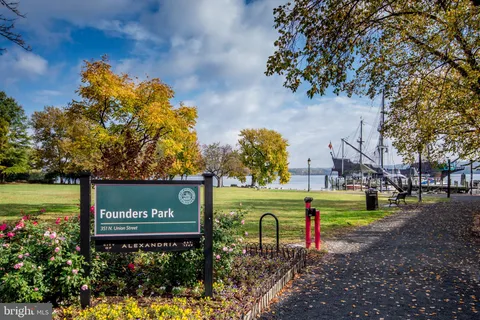 a view of a city in the middle of a park