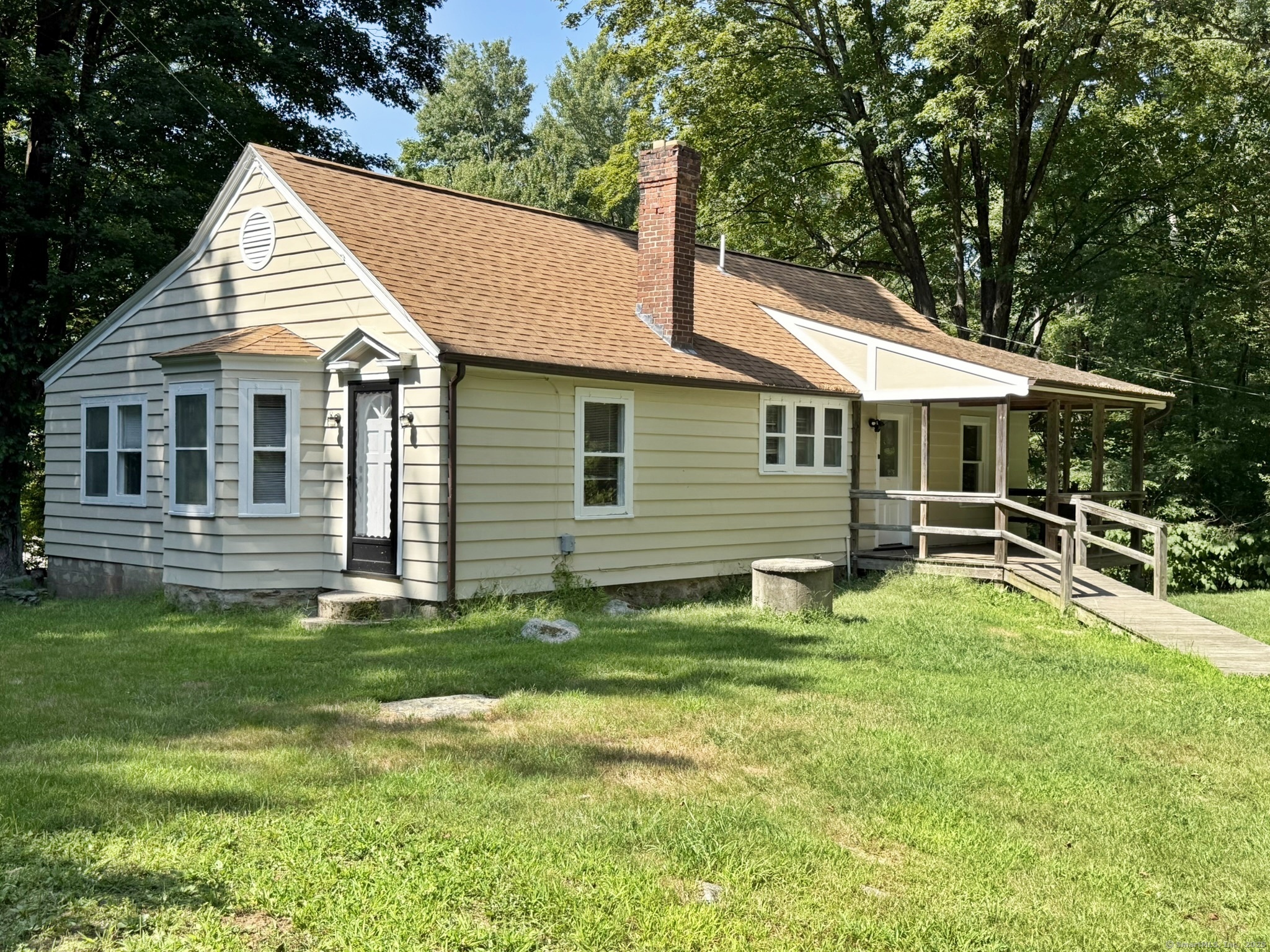 140 Hammertown Road Monroe, CT 06468 - Photo 1 of 1 a backyard of a house with table and chairs
