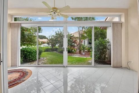 a view of a living room and a floor to ceiling window
