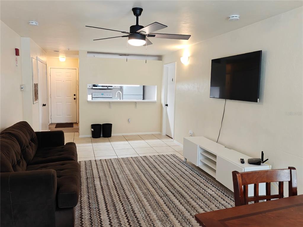 4000 Southwest 23rd Street, Unit 5207 ROOM B Gainesville, FL 32608 - Photo 14 of 23 a living room with furniture and a flat screen tv