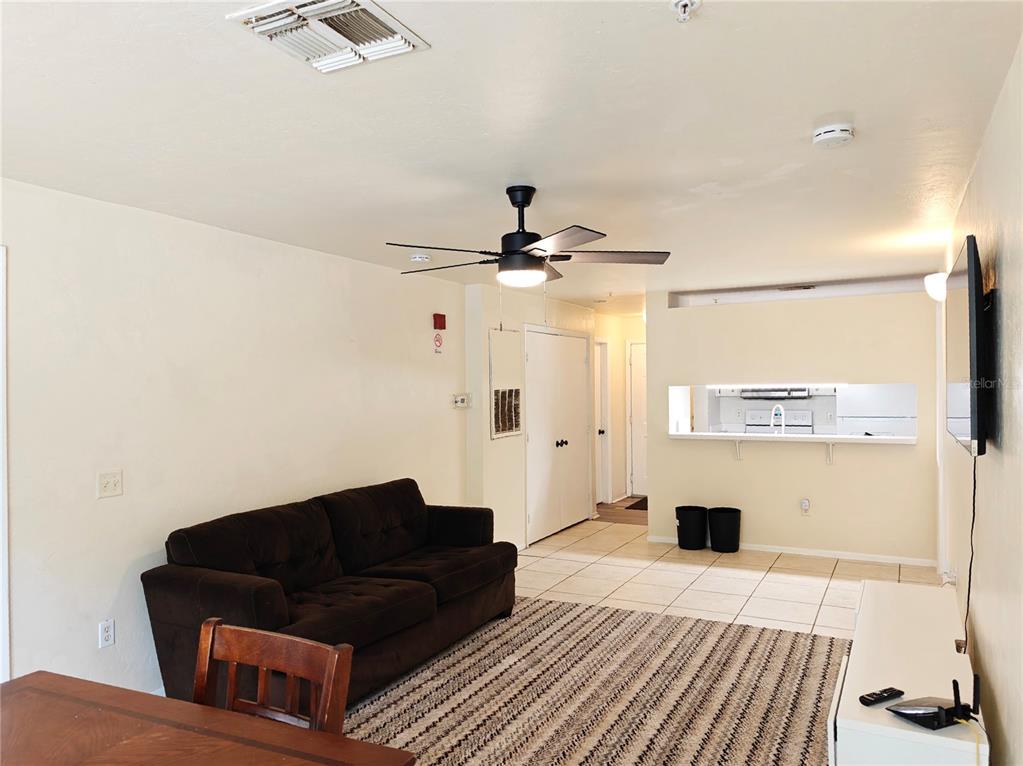 4000 Southwest 23rd Street, Unit 5207 ROOM B Gainesville, FL 32608 - Photo 15 of 23 a living room with a couch and a coffee table