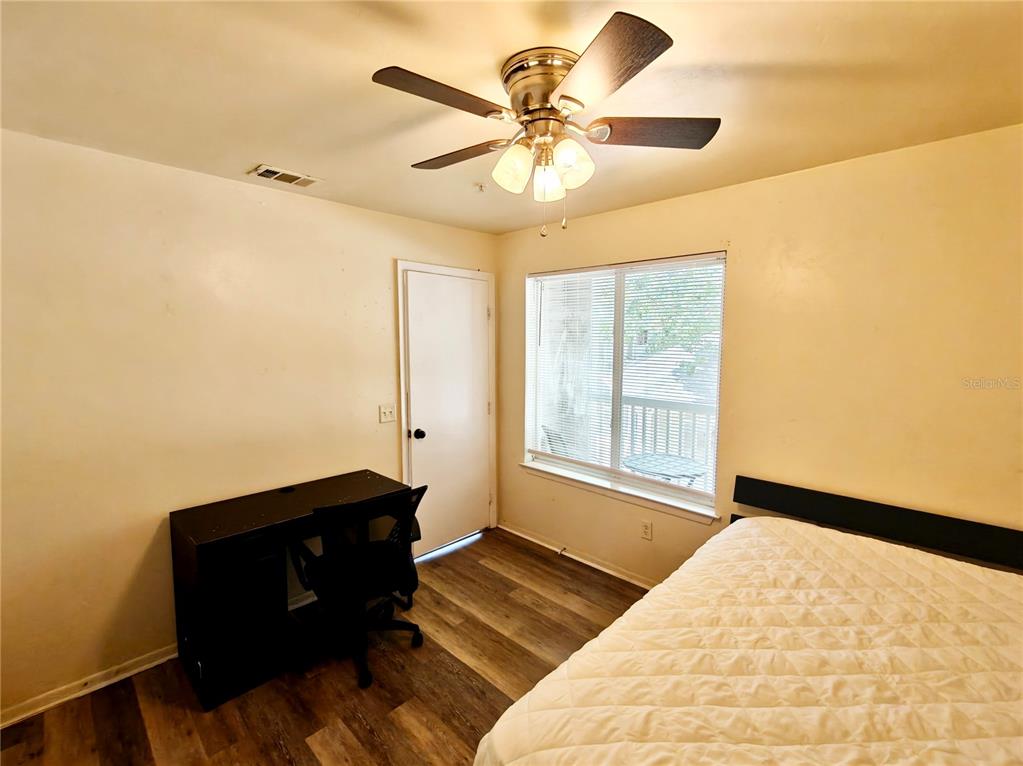 4000 Southwest 23rd Street, Unit 5207 ROOM B Gainesville, FL 32608 - Photo 4 of 23 a bedroom with a bed and a window