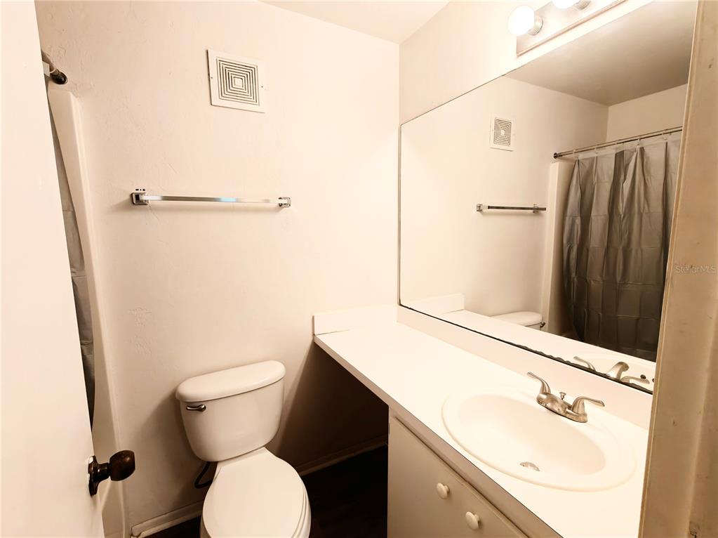 4000 Southwest 23rd Street, Unit 5207 ROOM B Gainesville, FL 32608 - Photo 7 of 23 a bathroom with a sink toilet and shower