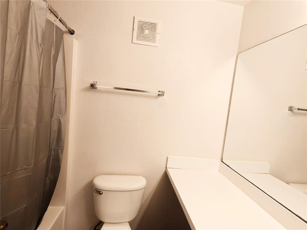 4000 Southwest 23rd Street, Unit 5207 ROOM B Gainesville, FL 32608 - Photo 8 of 23 a bathroom with a toilet and a shower