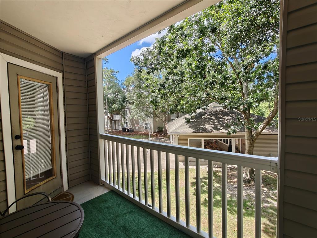 4000 Southwest 23rd Street, Unit 5207 ROOM B Gainesville, FL 32608 - Photo 10 of 23 a view of a porch with a yard