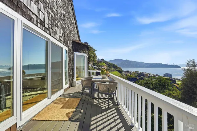 a view of a room with furniture and a window