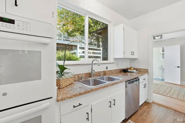 a bathroom with a sink a mirror and a bathtub
