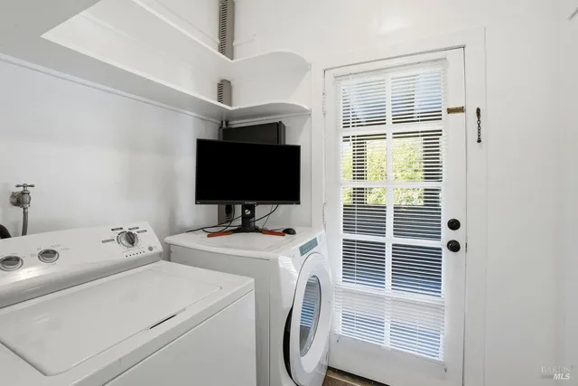 a bedroom with bed and a window