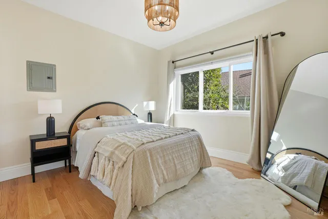 a room with a table and a painting on the wall