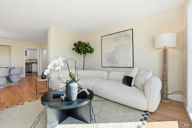 an aerial view of a house with a garden and lake view