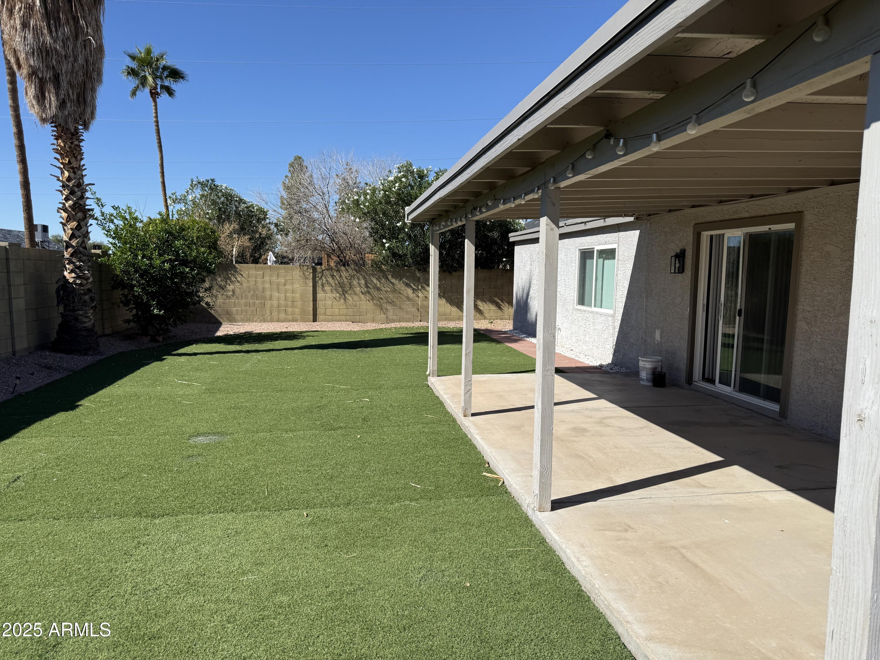 1213 East Tonto Lane Phoenix, AZ 85024 - Photo 19 of 19 a view of a house with backyard and porch
