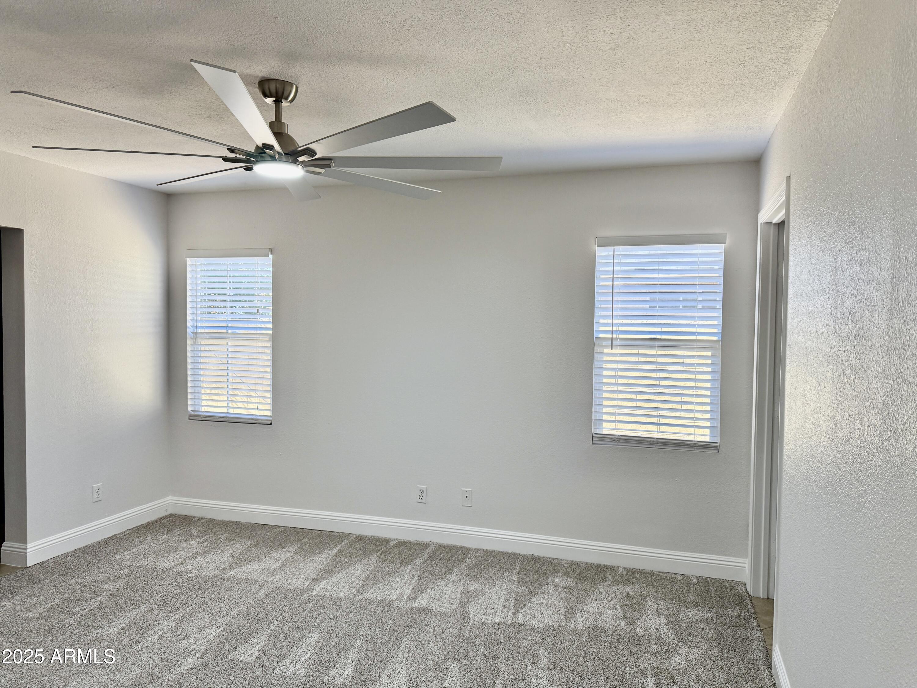 1213 East Tonto Lane Phoenix, AZ 85024 - Photo 7 of 19 a view of an empty room with a window