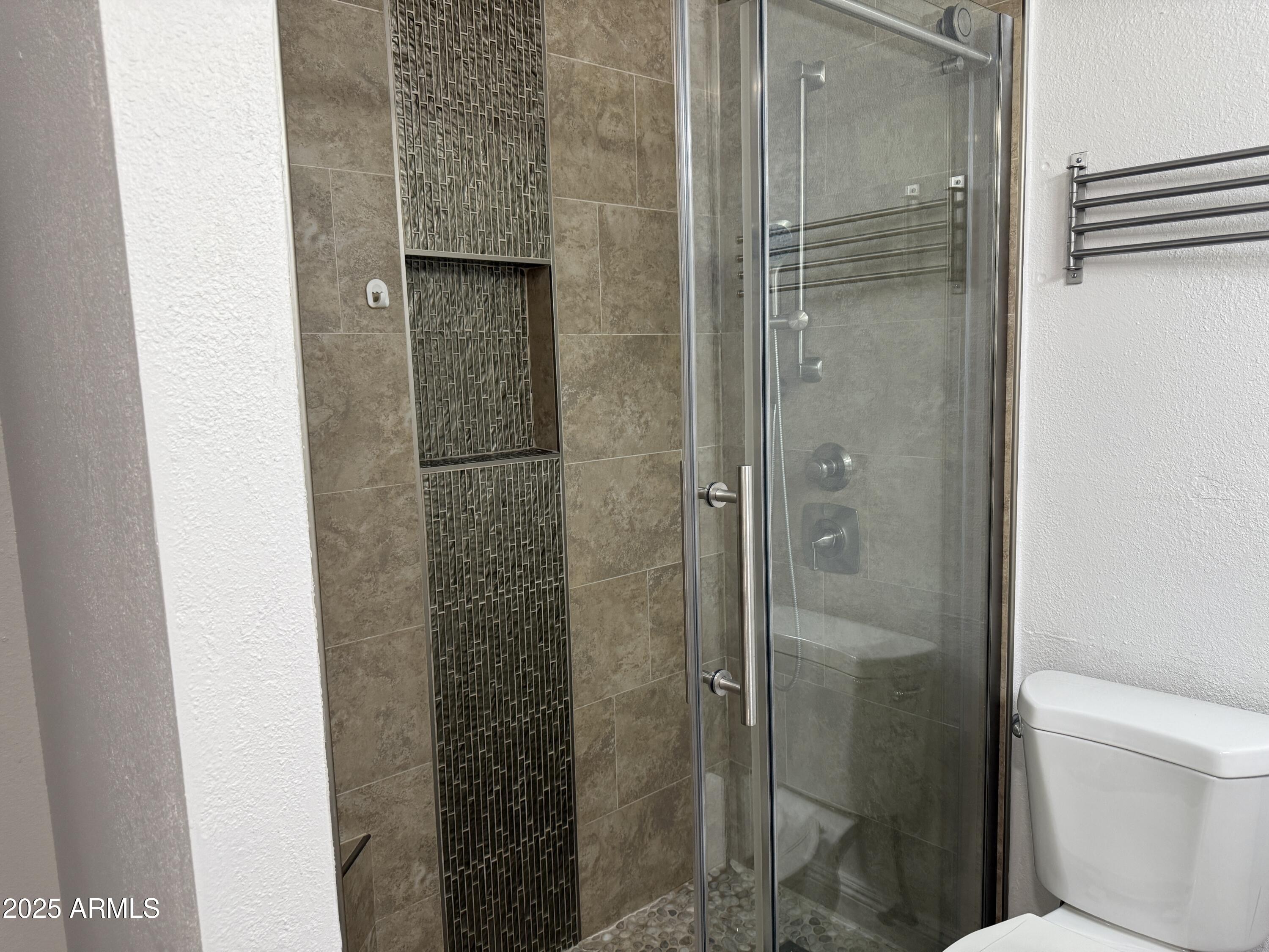 1213 East Tonto Lane Phoenix, AZ 85024 - Photo 10 of 19 a bathroom with a shower and a toilet