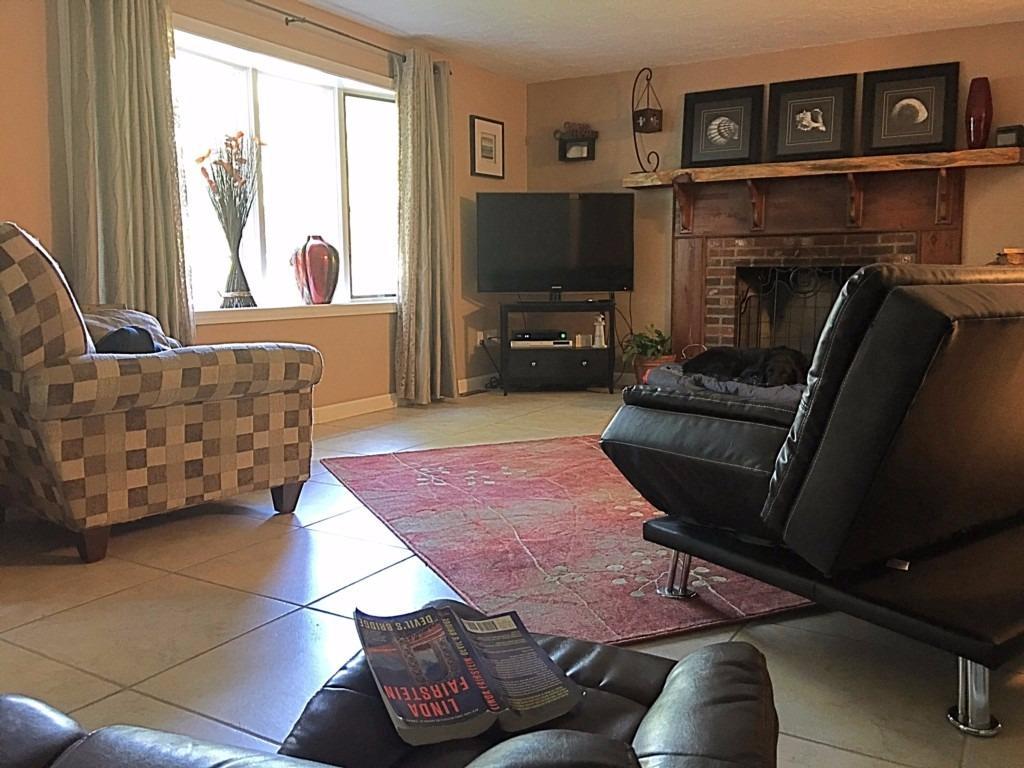 196 Capn Crosby Road Centerville, MA 02632 - Photo 11 of 25 a living room with furniture and a flat screen tv