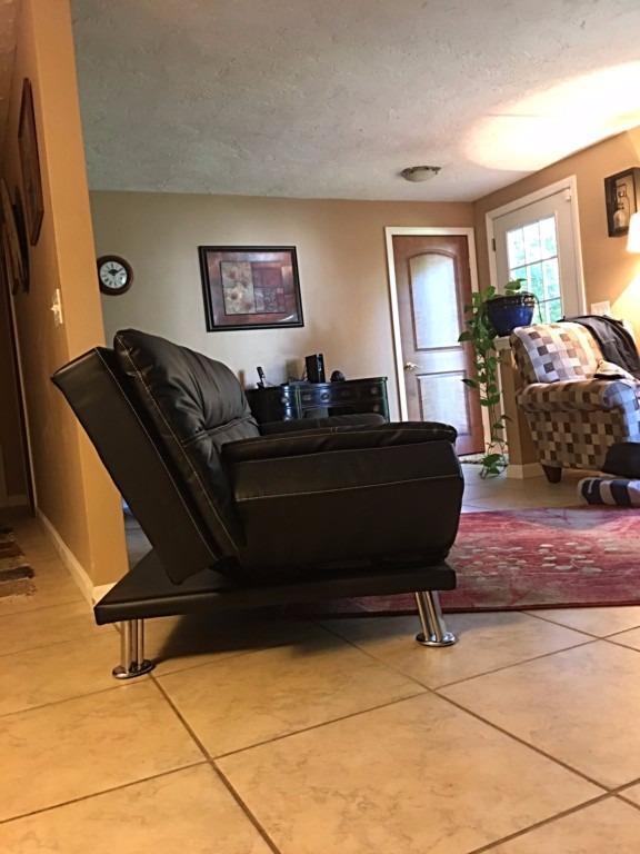 196 Capn Crosby Road Centerville, MA 02632 - Photo 12 of 25 a living room with a couch and a dresser