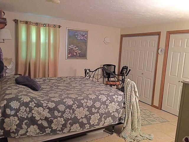 196 Capn Crosby Road Centerville, MA 02632 - Photo 14 of 25 a bedroom with a bed and a mirror