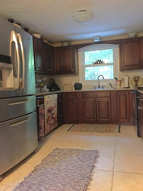196 Capn Crosby Road Centerville, MA 02632 - Photo 5 of 25 a kitchen with stainless steel appliances granite countertop a refrigerator and a sink