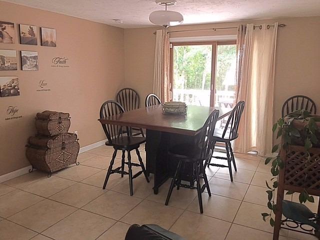 196 Capn Crosby Road Centerville, MA 02632 - Photo 8 of 25 a view of a dining room with furniture window and outside view