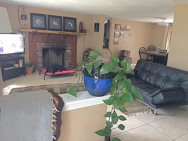 196 Capn Crosby Road Centerville, MA 02632 - Photo 9 of 25 a living room with furniture and a fireplace