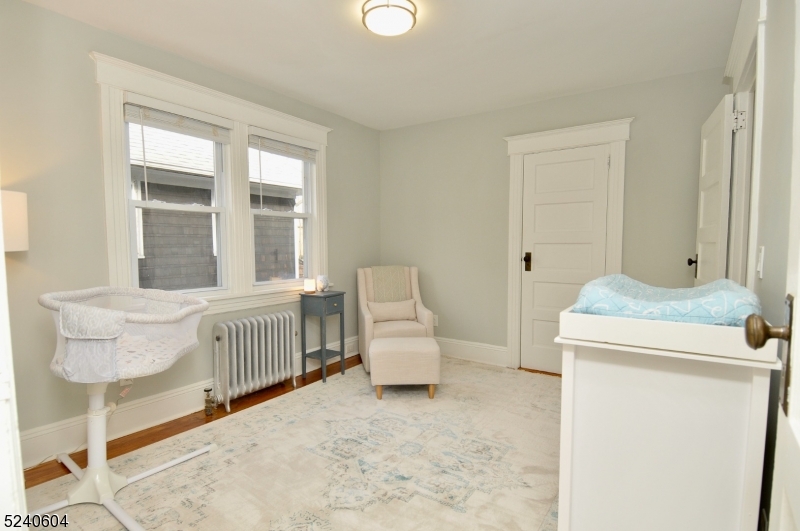 44 Dunnell Road Maplewood, NJ 07040 - Photo 12 of 17 a bedroom with furniture and a window