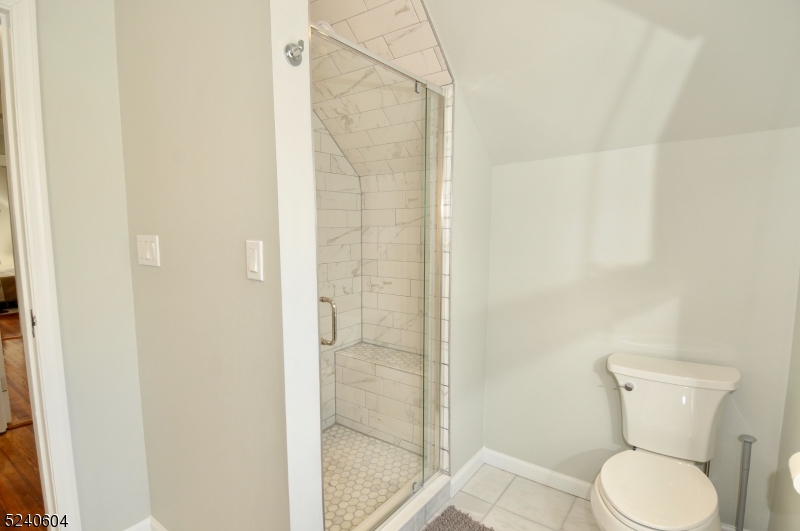 44 Dunnell Road Maplewood, NJ 07040 - Photo 16 of 17 a white toilet sitting next to a bathroom sink