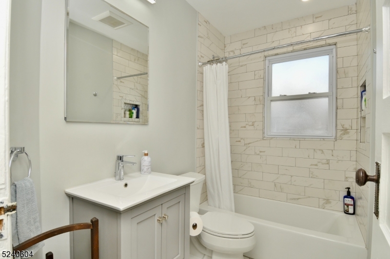 44 Dunnell Road Maplewood, NJ 07040 - Photo 10 of 17 a bathroom with a sink toilet and shower