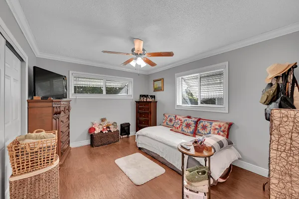 a bedroom with furniture and a window