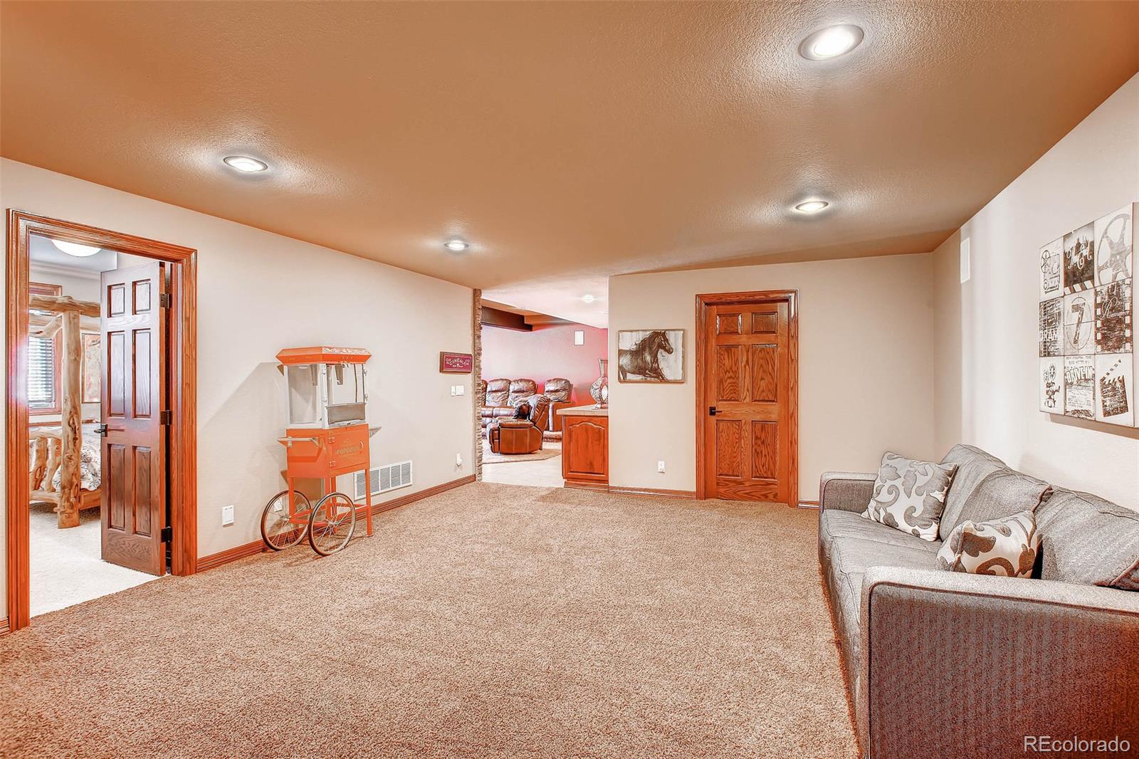 15241 Shadow Mountain Ranch Road Larkspur, CO 80118 - Photo 19 of 31 a living room with furniture and a couch