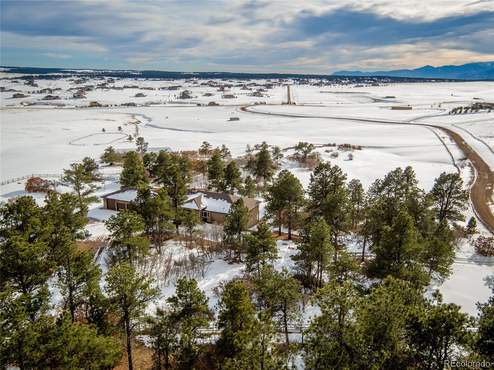 15241 Shadow Mountain Ranch Road Larkspur, CO 80118 - Photo 2 of 31 a view of ocean view with beach