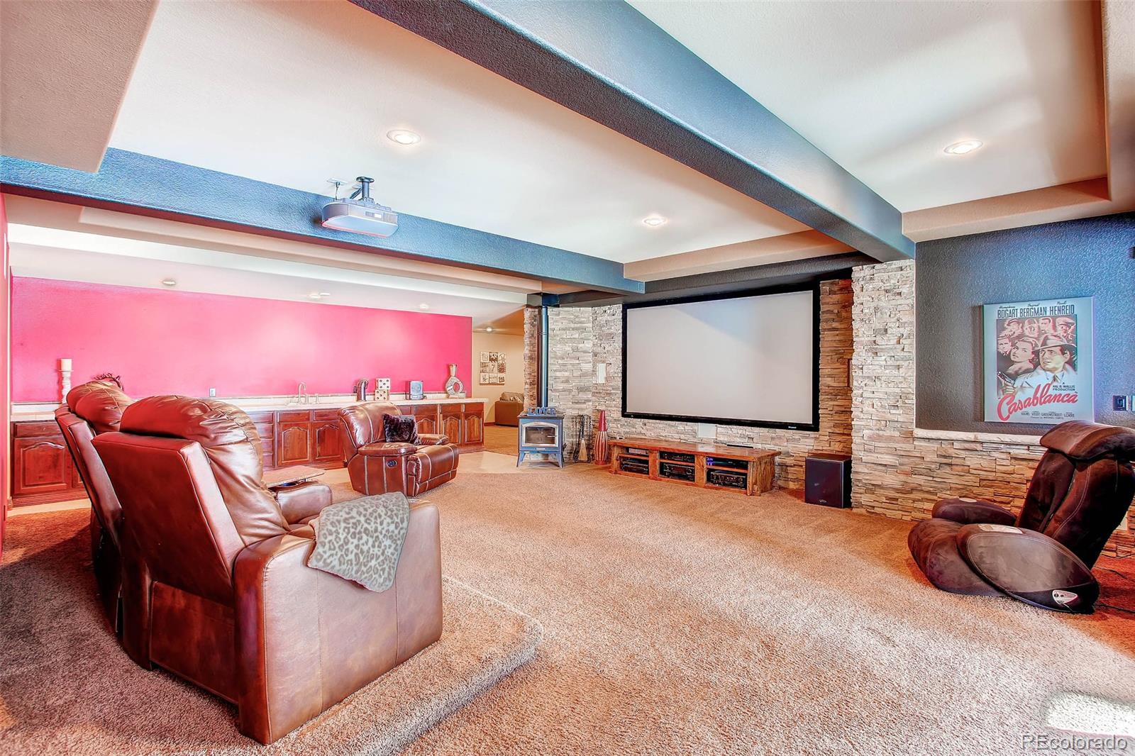 15241 Shadow Mountain Ranch Road Larkspur, CO 80118 - Photo 21 of 31 a living room with furniture and a flat screen tv