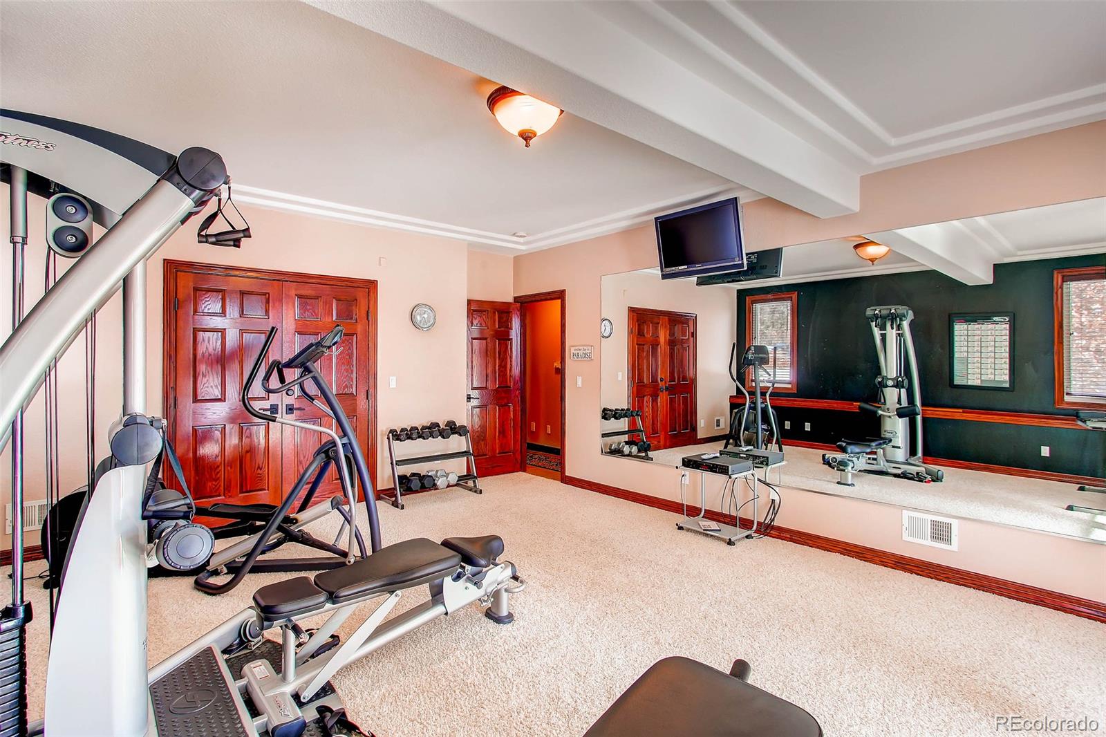 15241 Shadow Mountain Ranch Road Larkspur, CO 80118 - Photo 23 of 31 a view of a room with gym equipment
