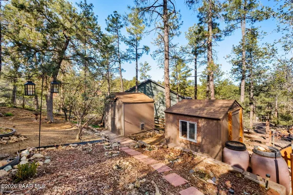 a view of a house with a yard and sitting area