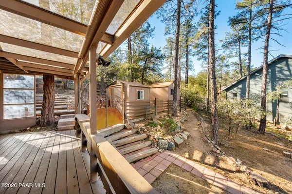 a view of balcony with wooden floor and outdoor seating