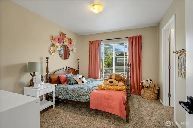 a bedroom with bed and a window