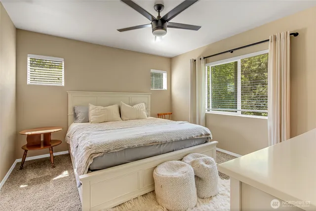 a bedroom with a bed and window