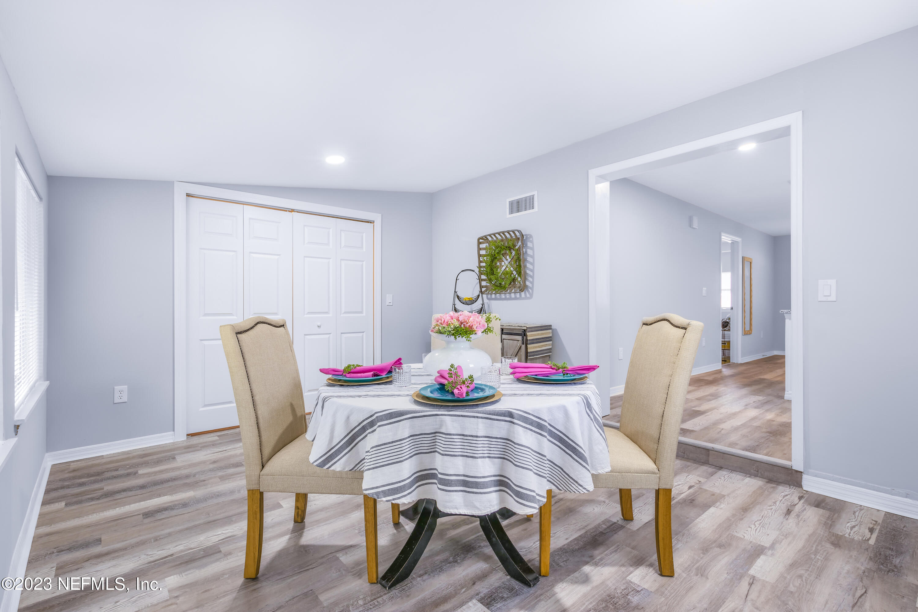 295 Edson Drive Orange Park, FL 32073 - Photo 11 of 37 a dining room with furniture and wooden floor