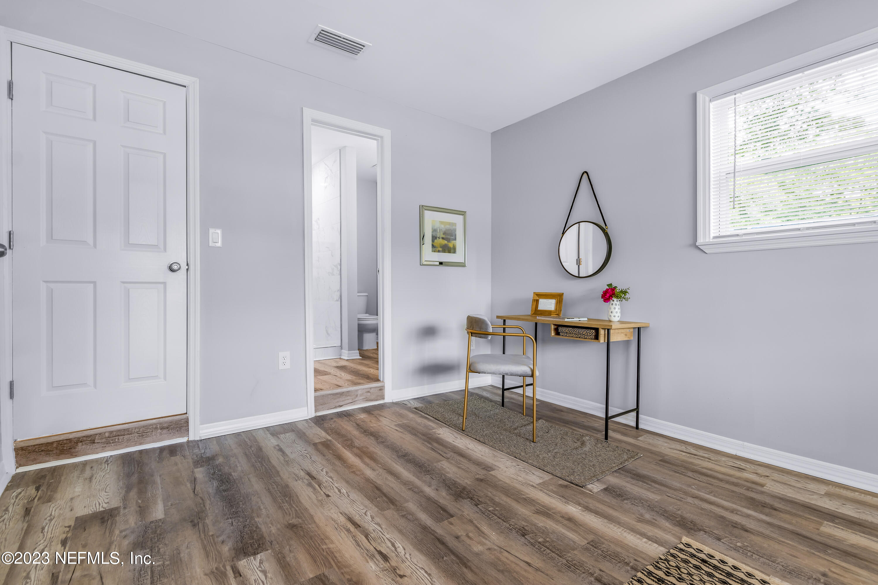 295 Edson Drive Orange Park, FL 32073 - Photo 17 of 37 a view of a room with wooden floor lounge chair and windows