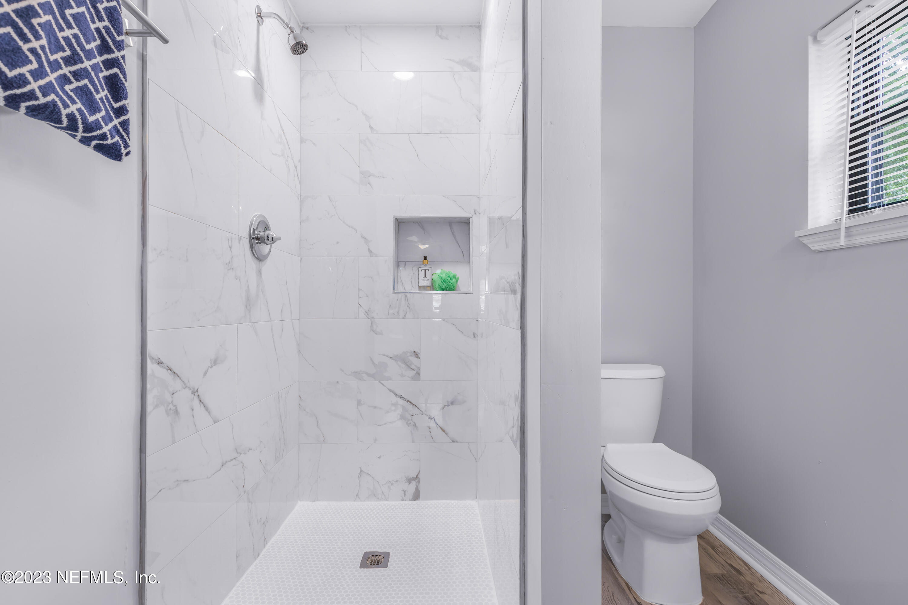 295 Edson Drive Orange Park, FL 32073 - Photo 18 of 37 a bathroom with a toilet and shower