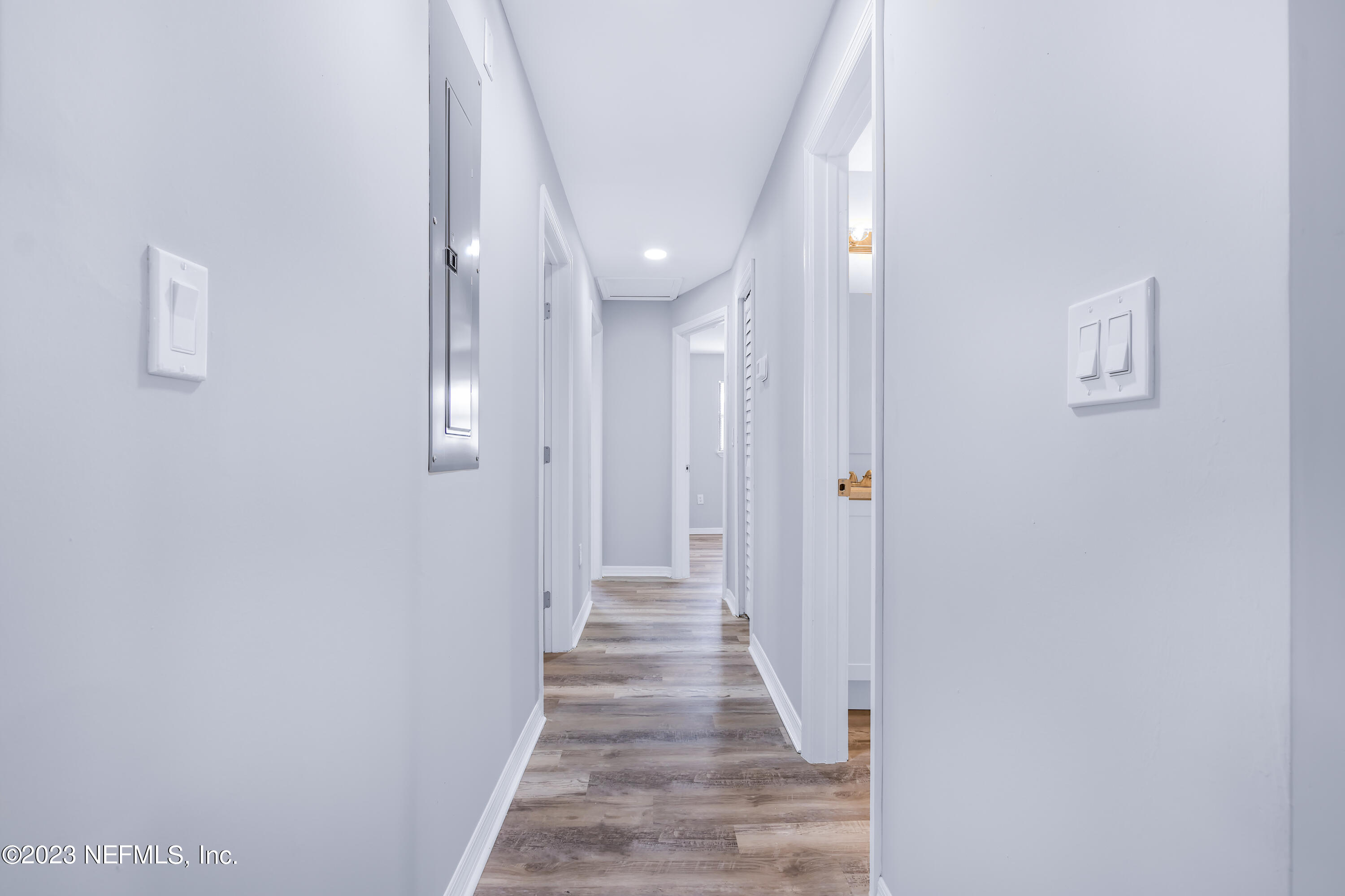 295 Edson Drive Orange Park, FL 32073 - Photo 23 of 37 a view of a hallway with wooden floor and staircase