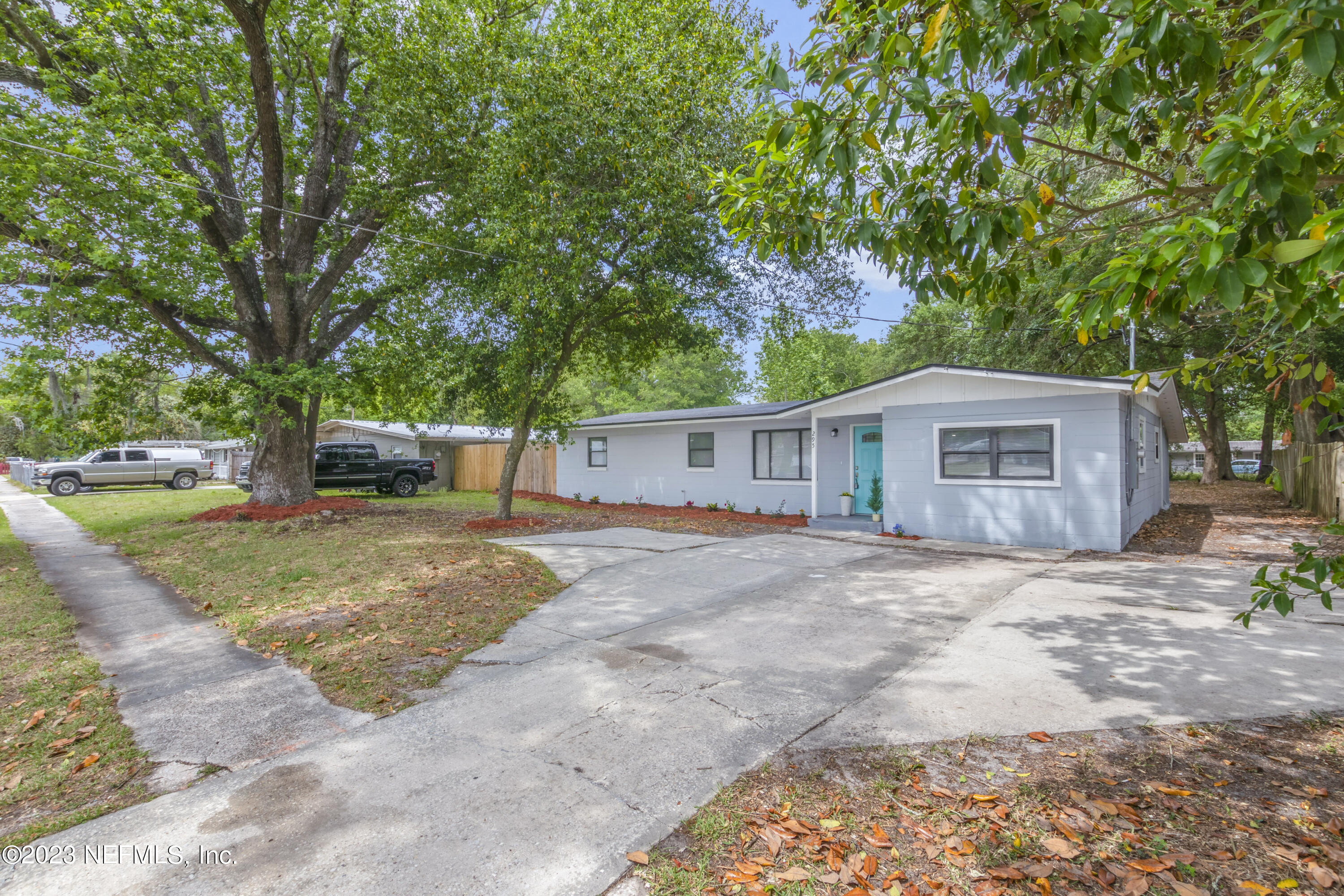 295 Edson Drive Orange Park, FL 32073 - Photo 3 of 37 a front view of a house with a yard and garage
