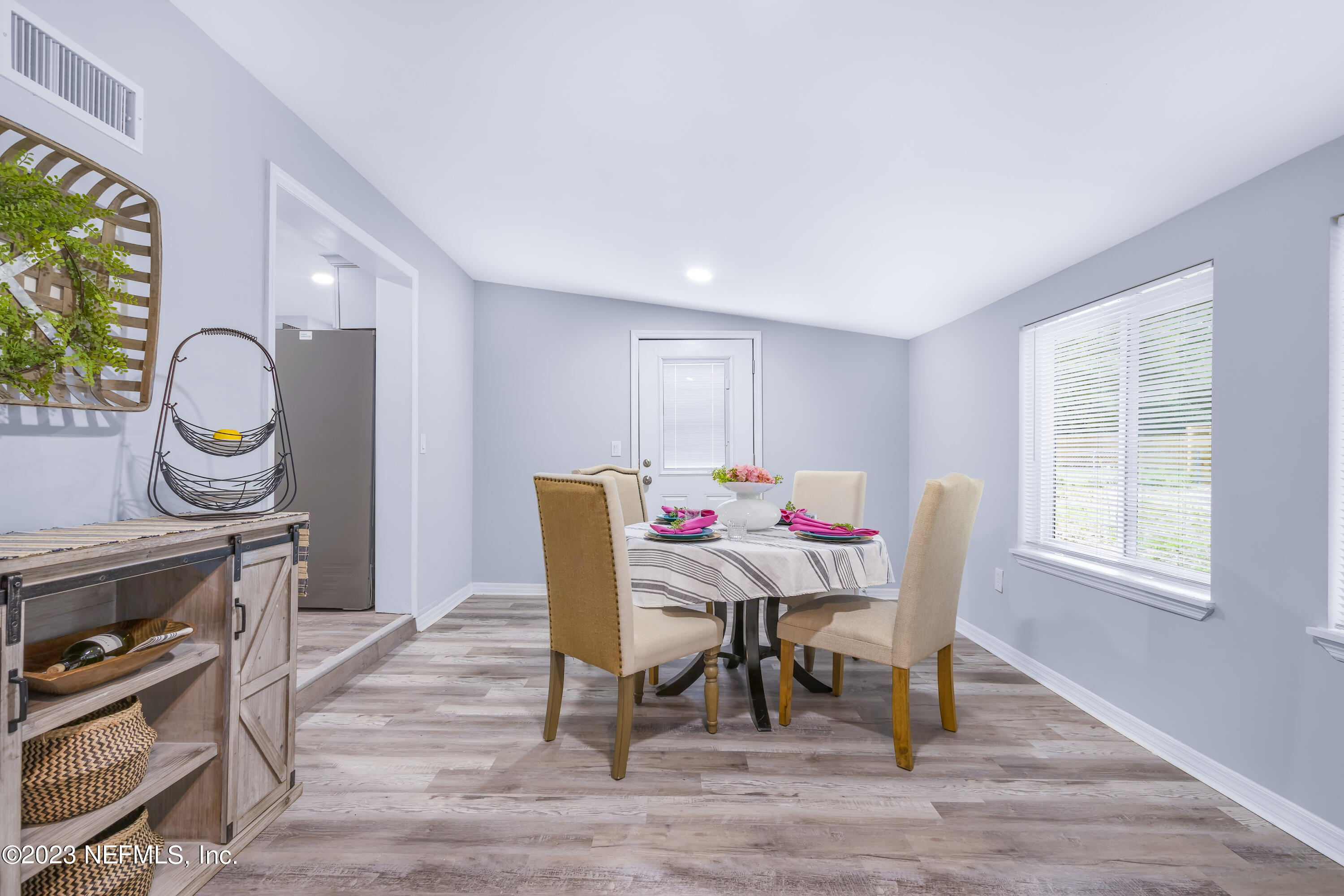295 Edson Drive Orange Park, FL 32073 - Photo 31 of 37 a view of a dining room with furniture window and wooden floor