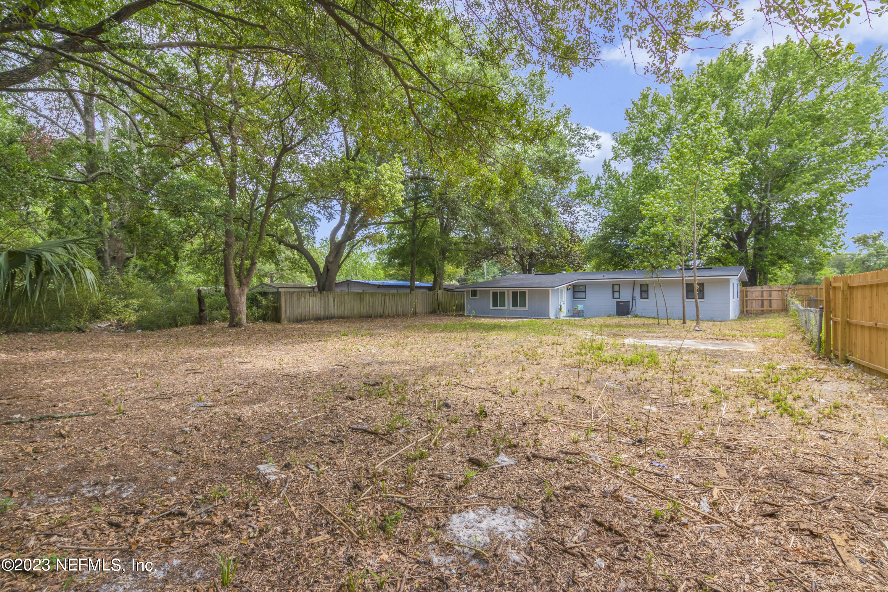 295 Edson Drive Orange Park, FL 32073 - Photo 34 of 37 a backyard of a house with lots of green space