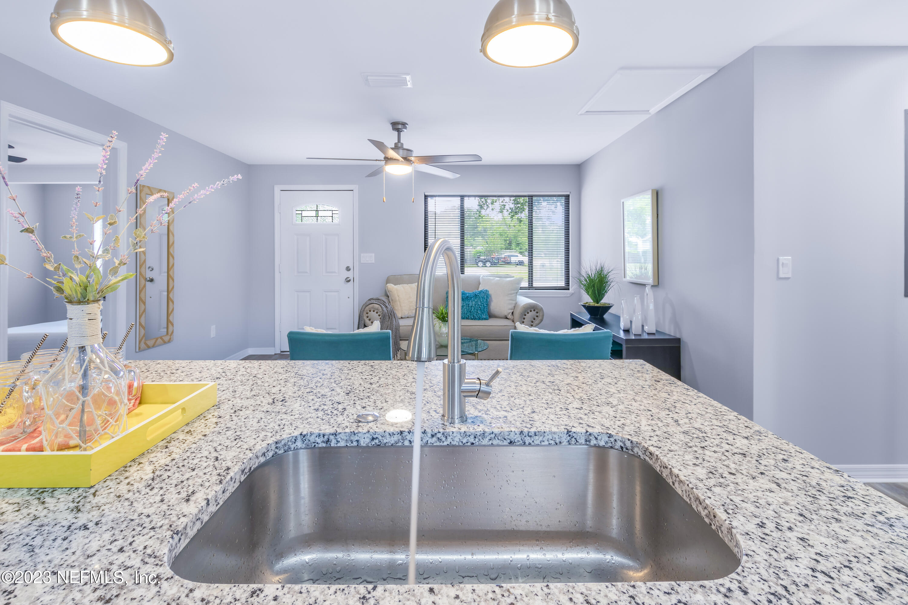 295 Edson Drive Orange Park, FL 32073 - Photo 10 of 37 a bathroom with a granite countertop sink a large mirror and shower