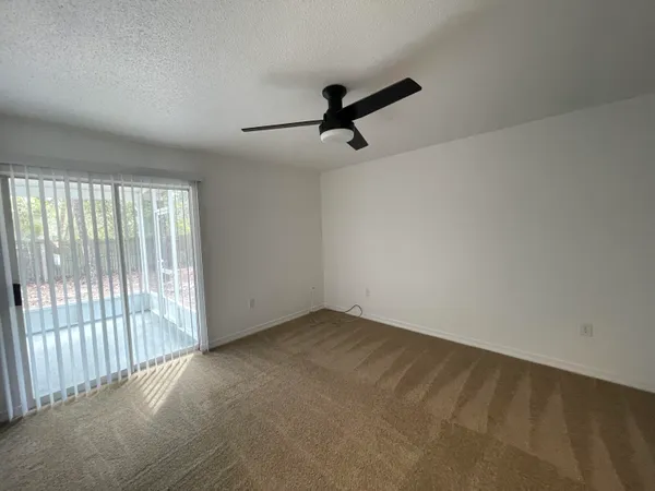 a view of an empty room with a window