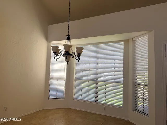 a kitchen with stainless steel appliances granite countertop a sink and a refrigerator