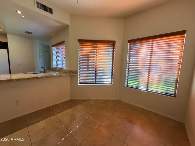 an empty room with a empty space and a window