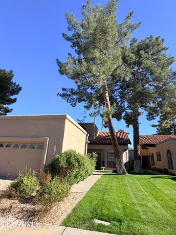 a view of a house with a yard