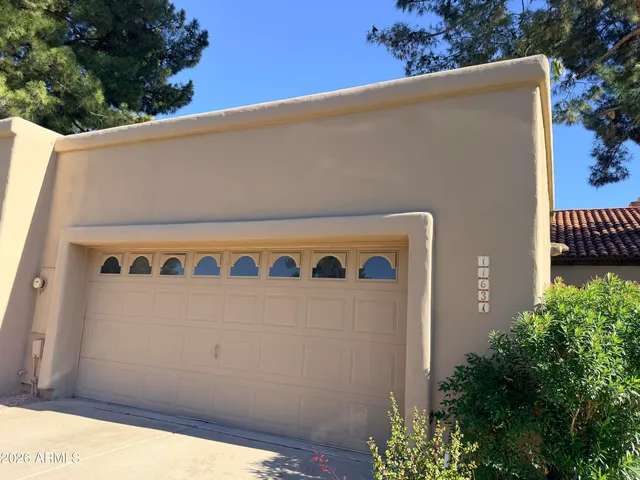 a view of a hallway with wooden cabinet and fireplace