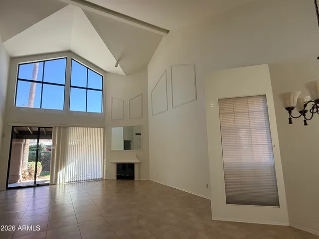 a view of staircase with railing and white walls